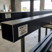 Metal profiles with labels on a workshop floor