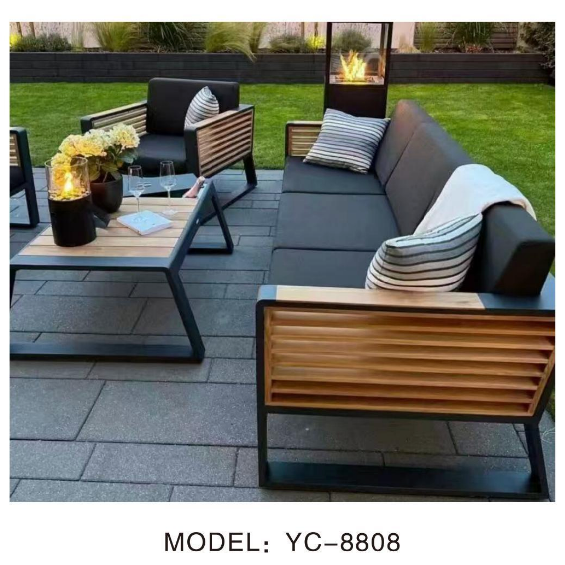 Outdoor patio furniture set with a fire pit on a paved patio.