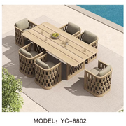 Outdoor furniture set with a table and chairs by a poolside, featuring model YC-8802.