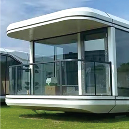Modern modular building with glass walls on a grassy area