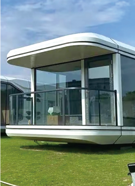 Modern modular building with glass walls on a grassy area