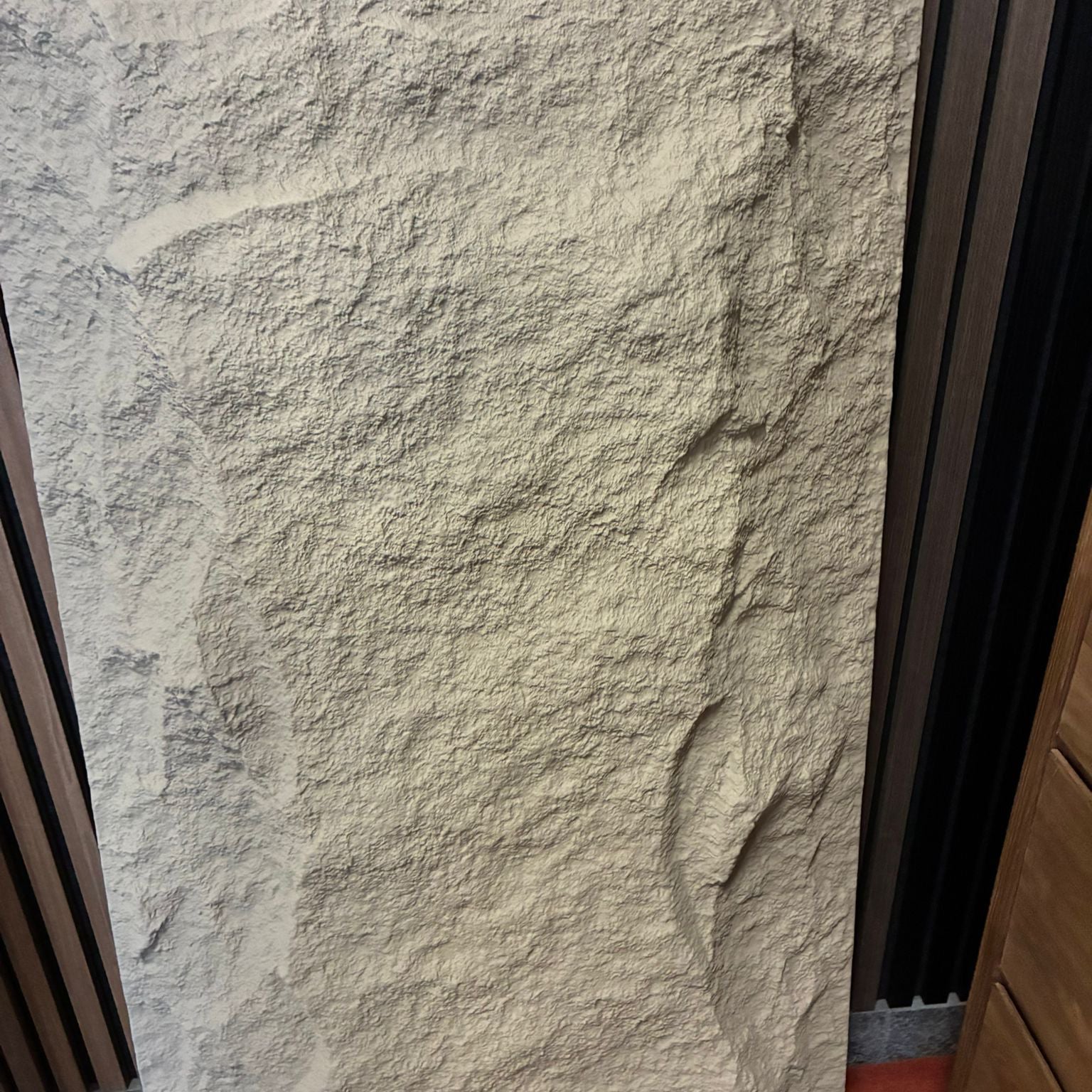 Large stone slab with natural texture against a dark background
